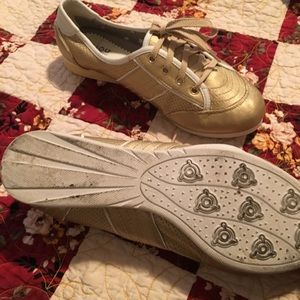Gold tennis shoes