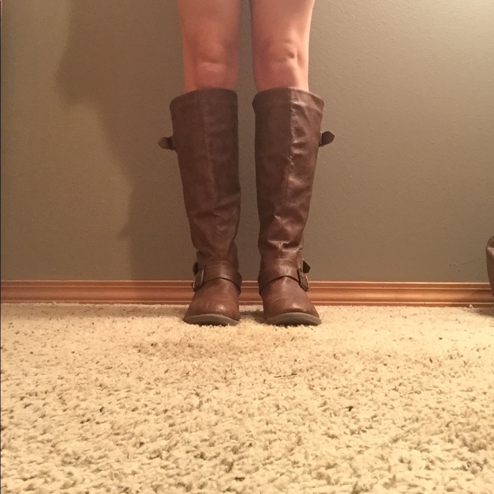 Brown boots just below the knees