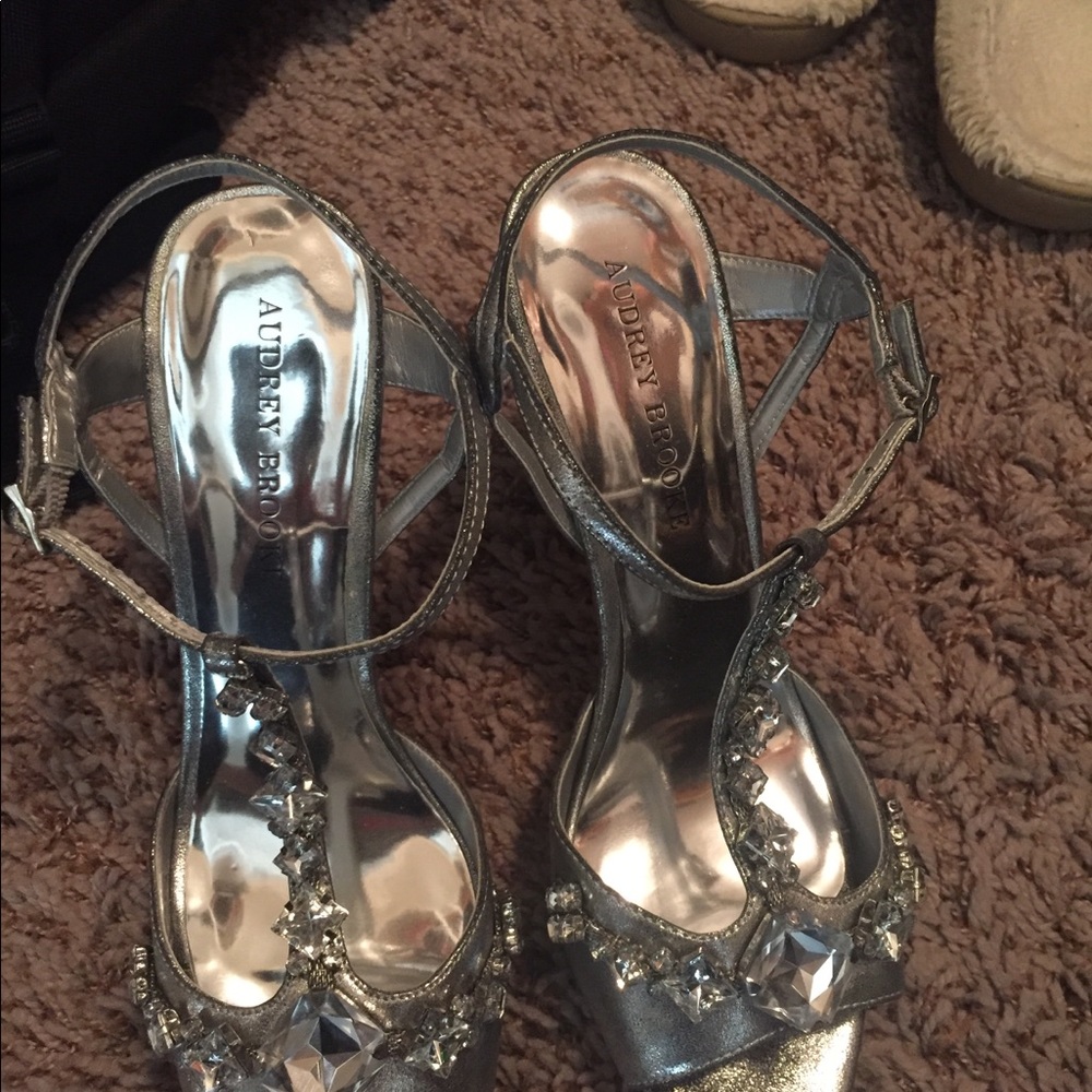 Dressed up high heels silver shoes.