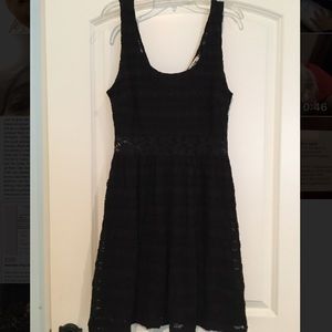 Black lace dress with see-through middle band.