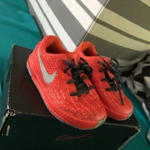 Pair of orange Kevin Durant low-top sneakers