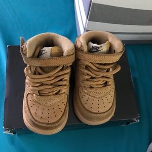 Brown Nike high-top Air Force ones