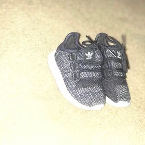 Baby's pair of gray-and-white Adidas sneakers
