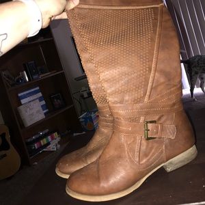 Tall brown boots. Worn but in very good condition.