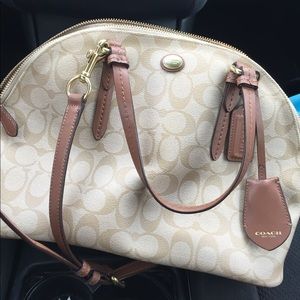 Brown dome shaped Coach purse
