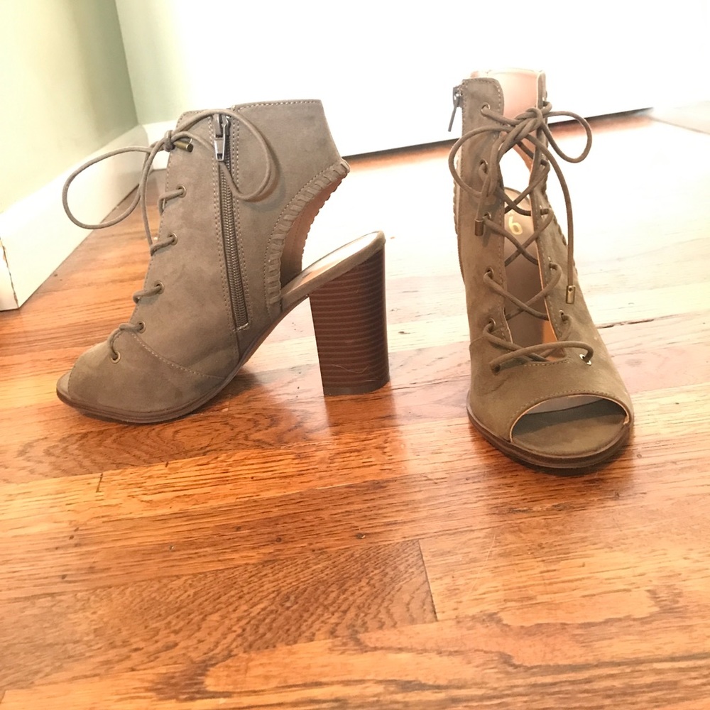 Chunky heel faux suede lace up peep toe booties.