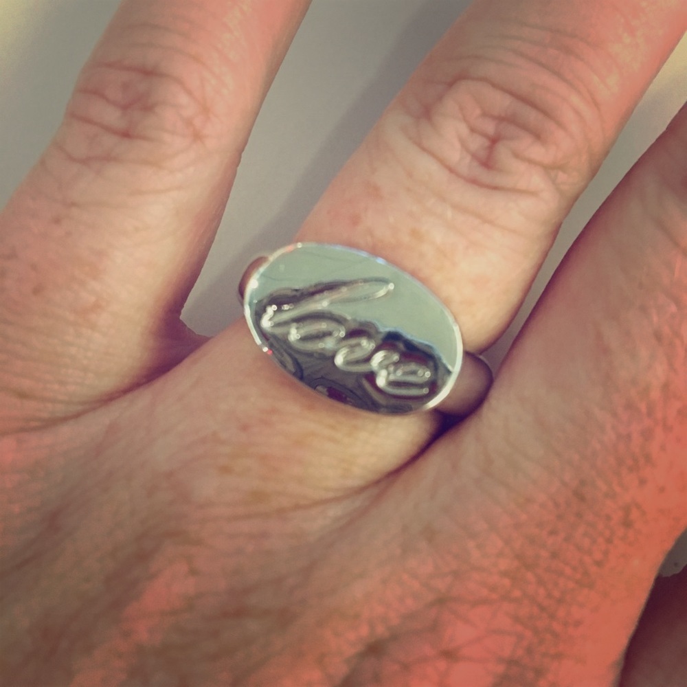 Lia Sophia silver ring. Says Love on front. Size 8