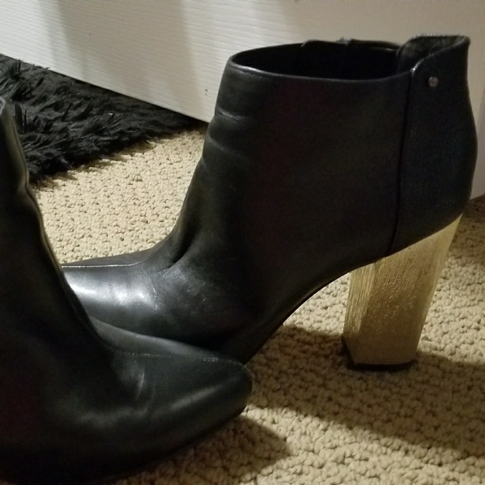Black booties with gold heel