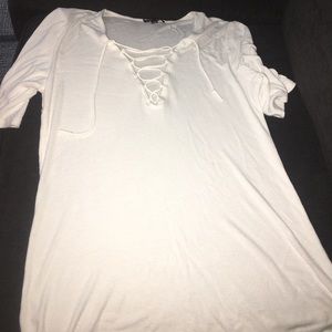 White V-neck with short sleeves.