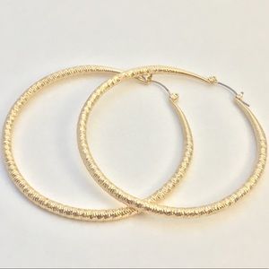 Gold-tone hoop earrings by Guess