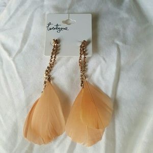 Peach colored feather earrings with gold rinestone
