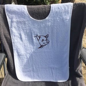 Adult size bib, embroidered pig head.