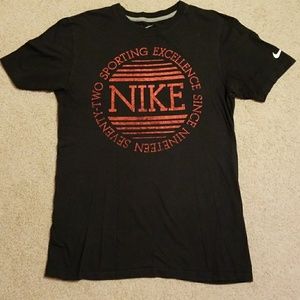 Black Nike T-shirt with red lettering