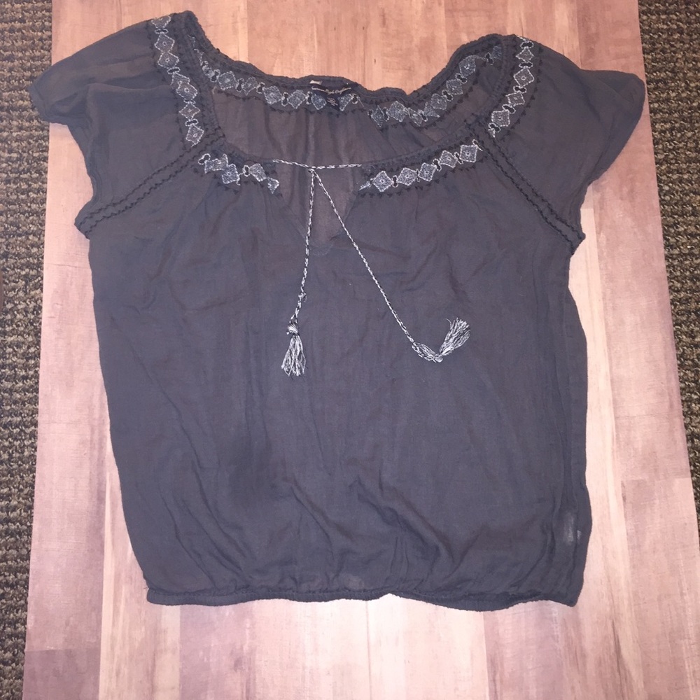 Blue peasant blouse with embroidered neck line.