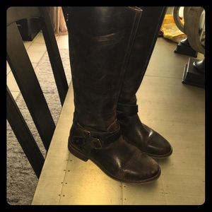 Broken in riding style brown leather boots