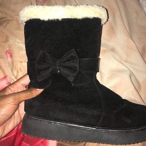 Black Boots With A Bow And White Trim