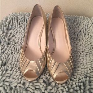 Etienne Aigner gold wedges