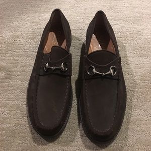 Gucci suede loafers with silver horse-bit detail.
