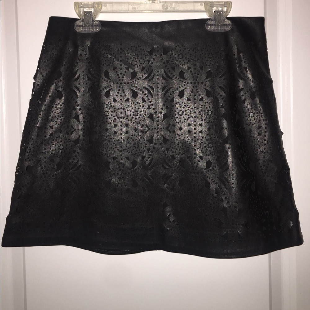 Faux leather skirt with patterned details on front
