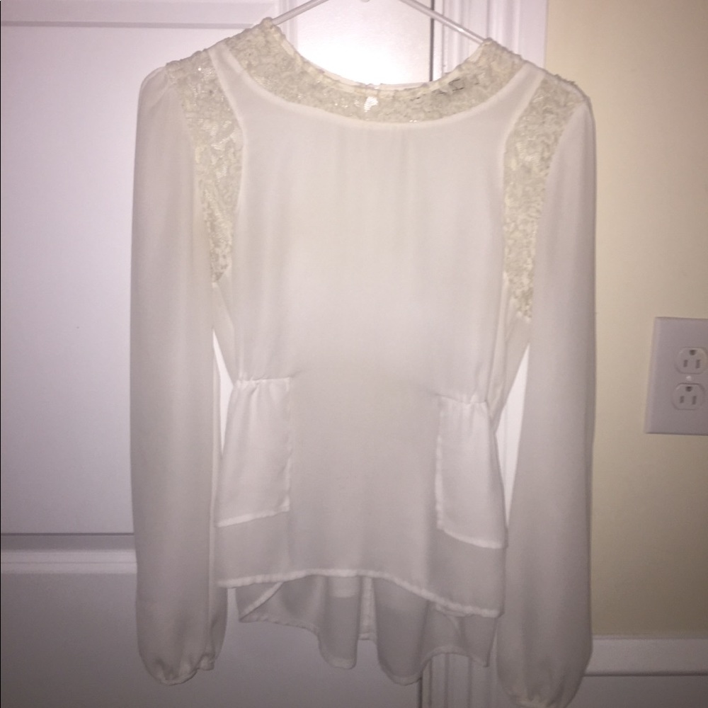 White peplum blouse with lace detail
