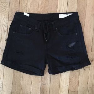 Ripped black denim shorts.