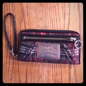 Red, black, and white plaid Coach clutch