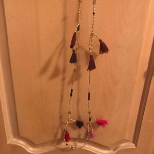 Long beaded necklace with tassels