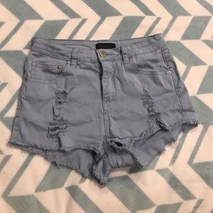 Blue ripped shorts