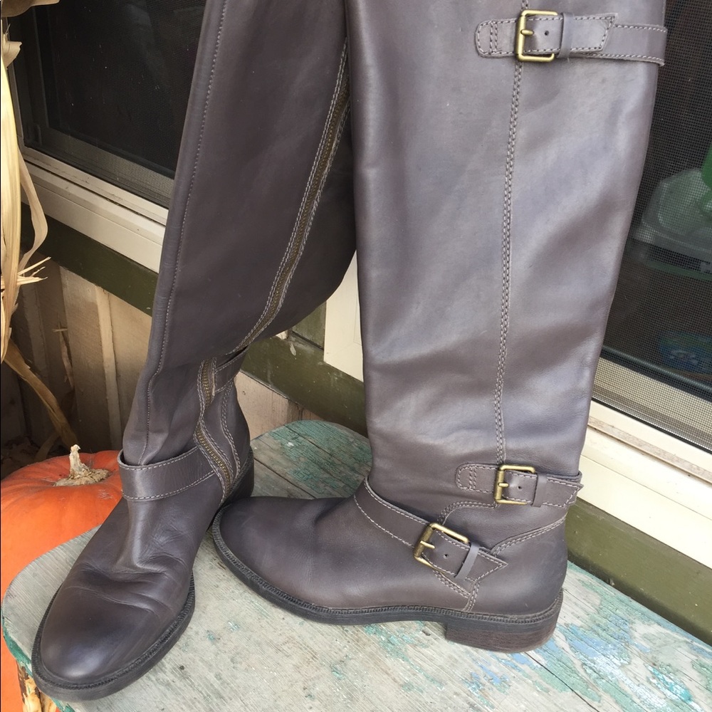 Gray Leather knee high boots.