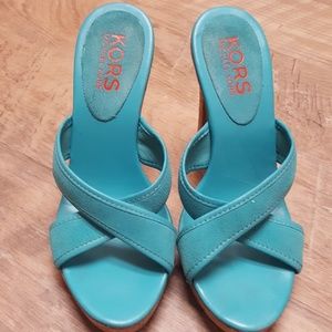 Awesome Turquoise Suede Kors platform shoes.