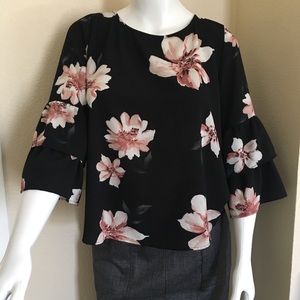 Flowing top, deep to bra strap V on back