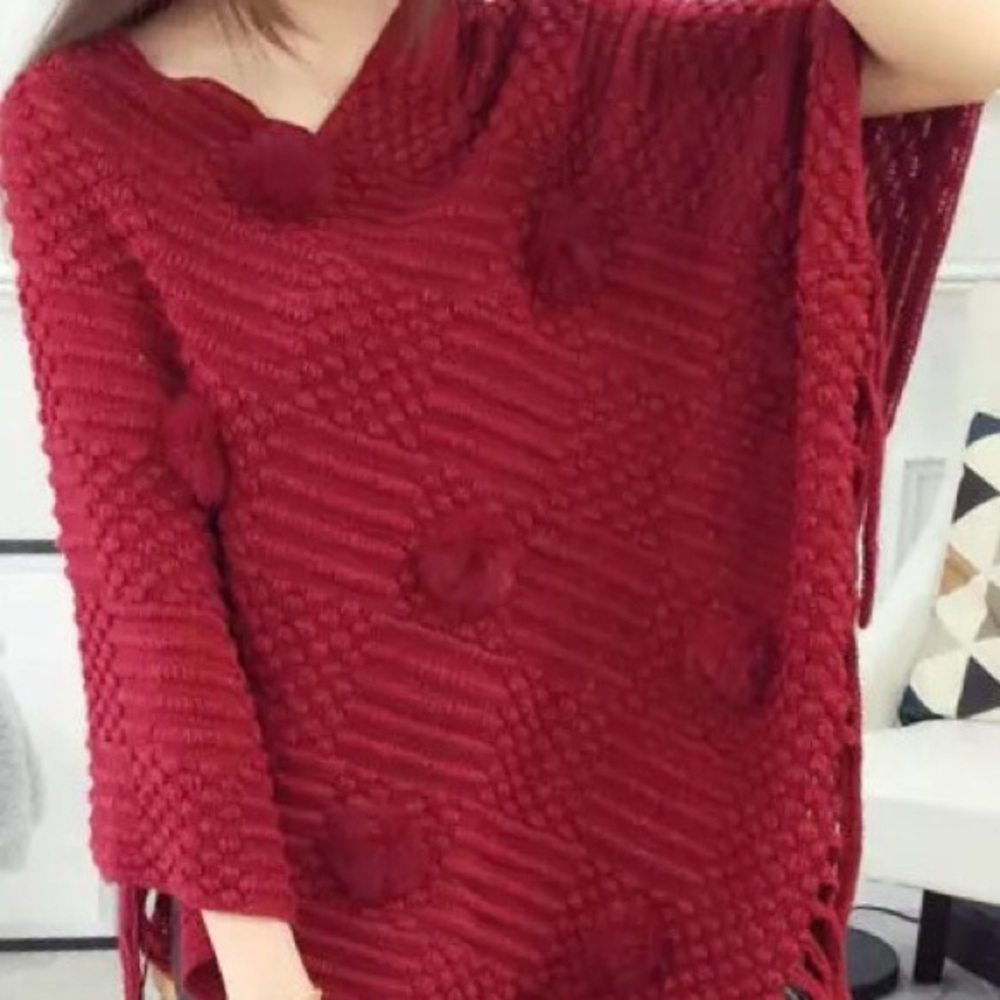 Red poncho with fox applications