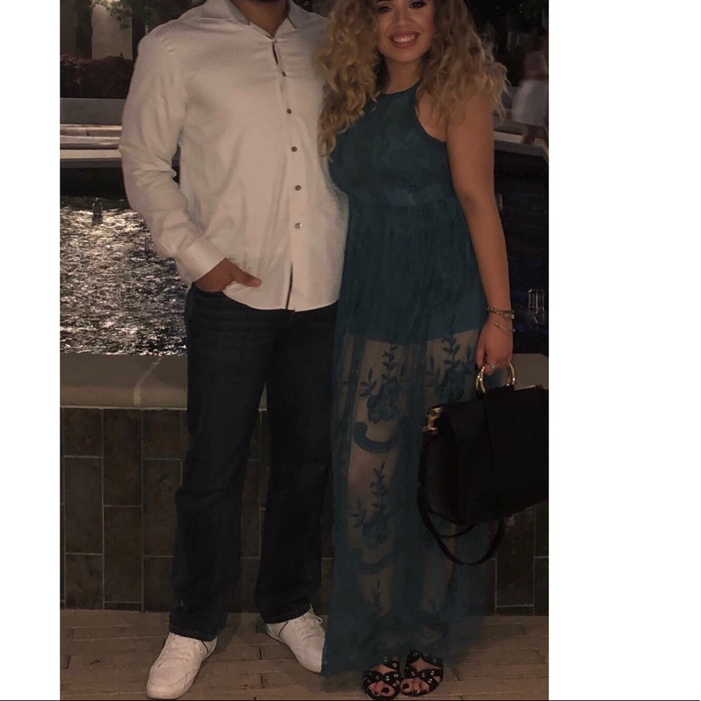 Long emerald colored lace dress.