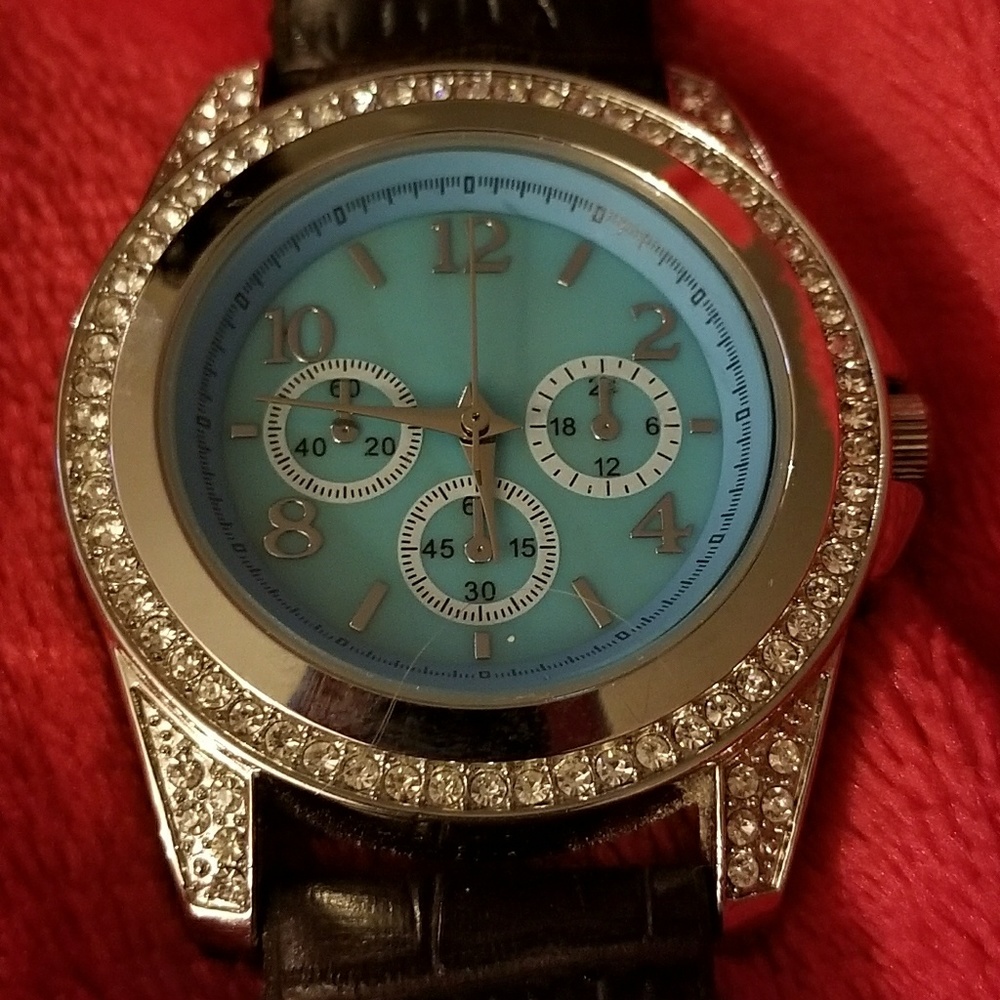 Women's Bezel watch / crystals around