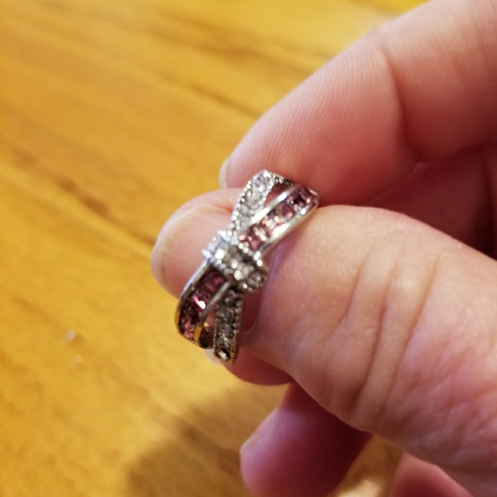 Pink and white topaz crossover ring