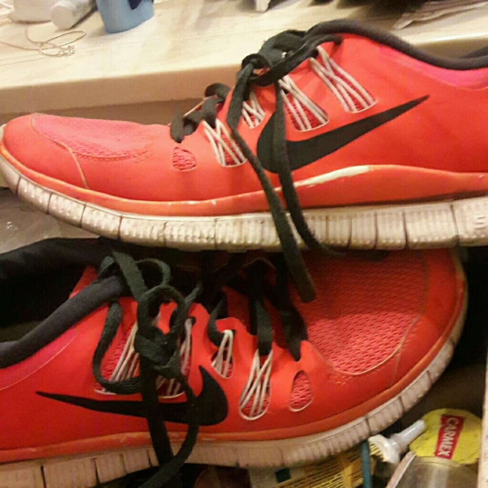 Orange Nike athletic shoes