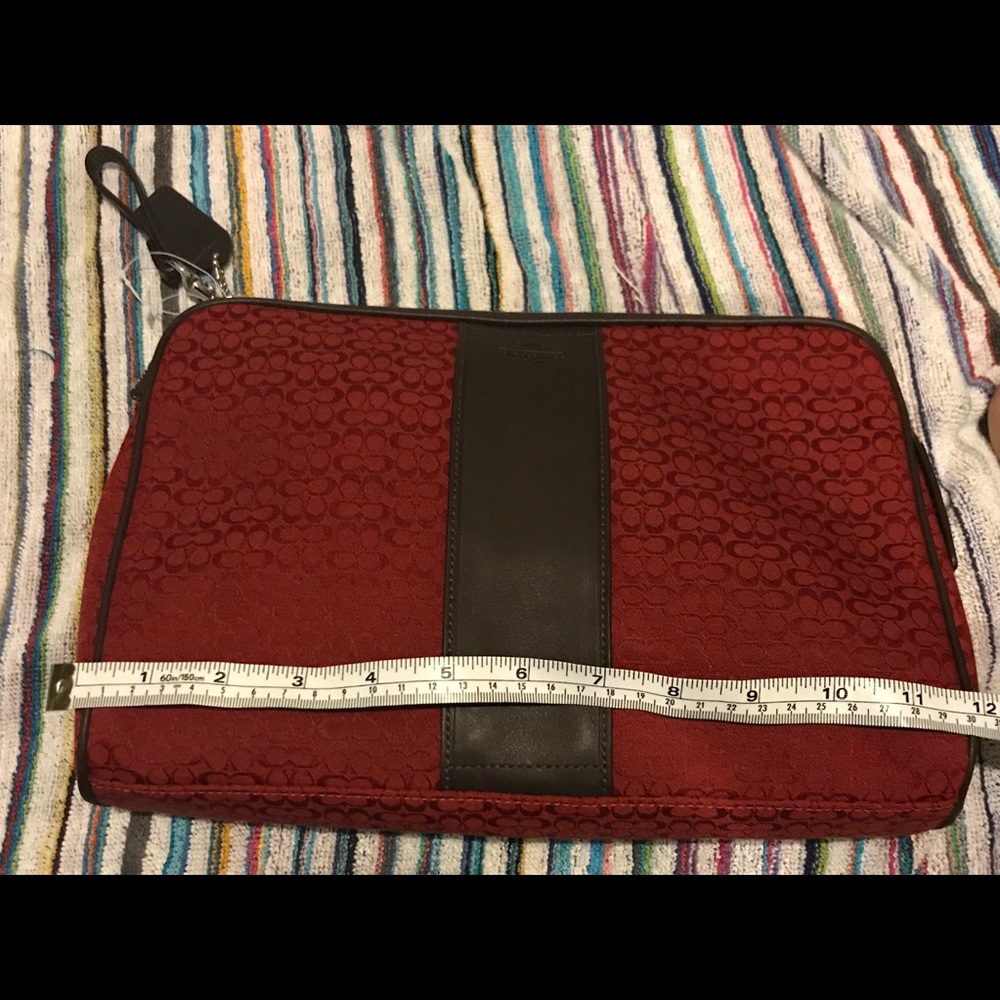 New without tags. Coach red travel/cosmetic bag.