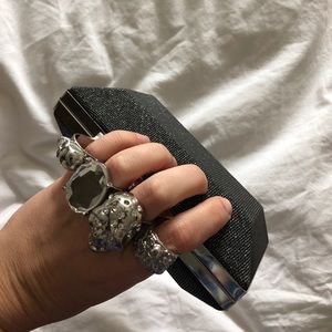 Grey metallic clutch with ring handle