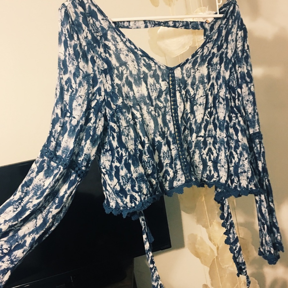 Blue flowy open back shirt