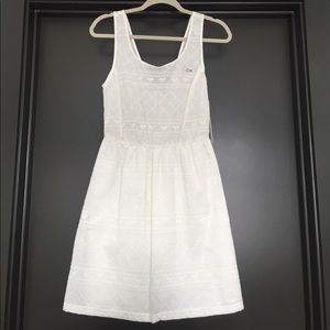 Lacoste white eyelet dress. Size S. NWT