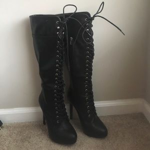 Lace up heeled knee length boots