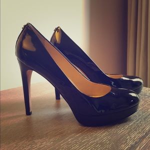 Black patent leather Coach stilettos