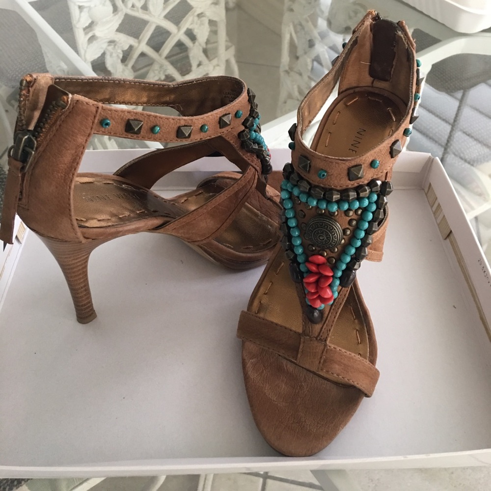 Brown beaded front Nine West heels worn in home