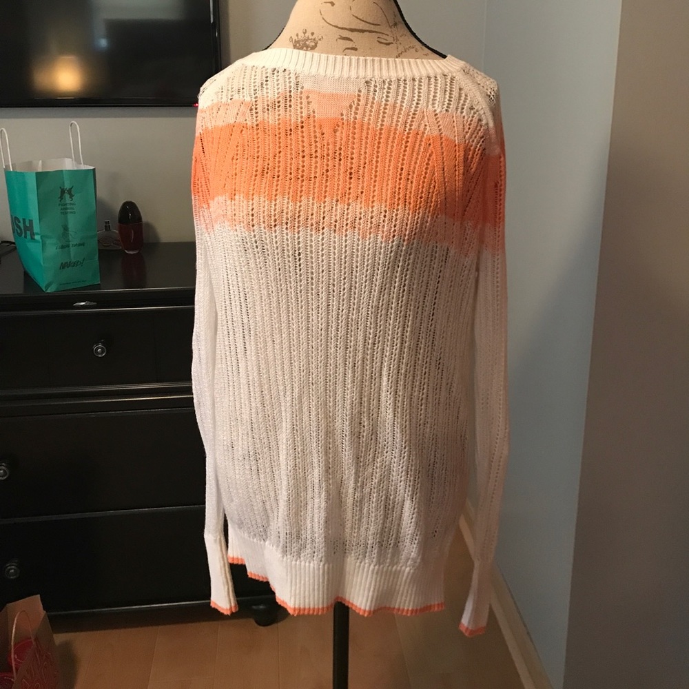White / peach sweater