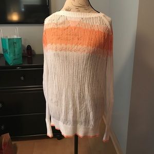 White / peach sweater