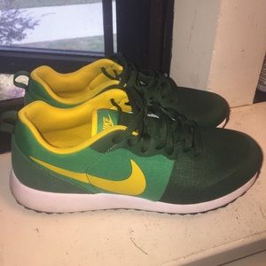 Green and yellow casual NIKE Running sneakers.