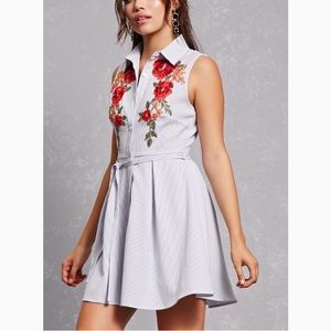 Shirt dress featuring a floral embroidery