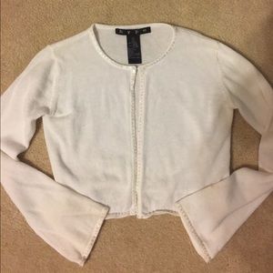 Girls small white sweater, sequin trimmed.