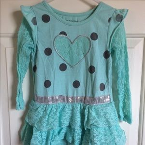 Teal long sleeve top with a skirt bottom