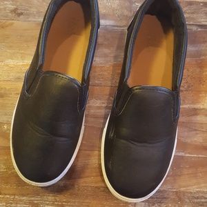 Black faux leather slip on neakers